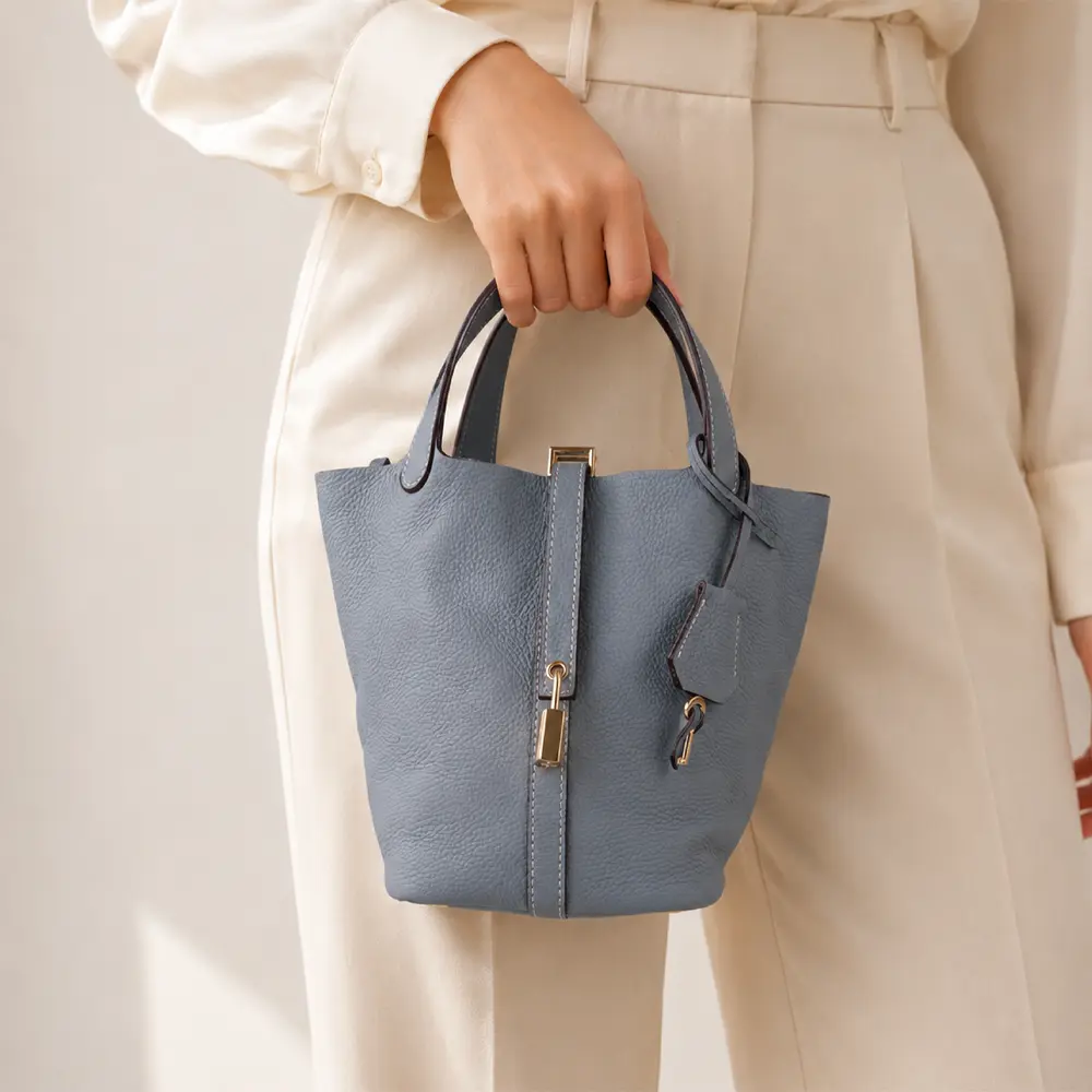 Bansuri (M) - Powder Blue Premium cowhide leather bucket Bag for women| spacious everyday handbag| durable & stylish Ladies shoulder bag| Multi-purpose bag for work, travel, sopping